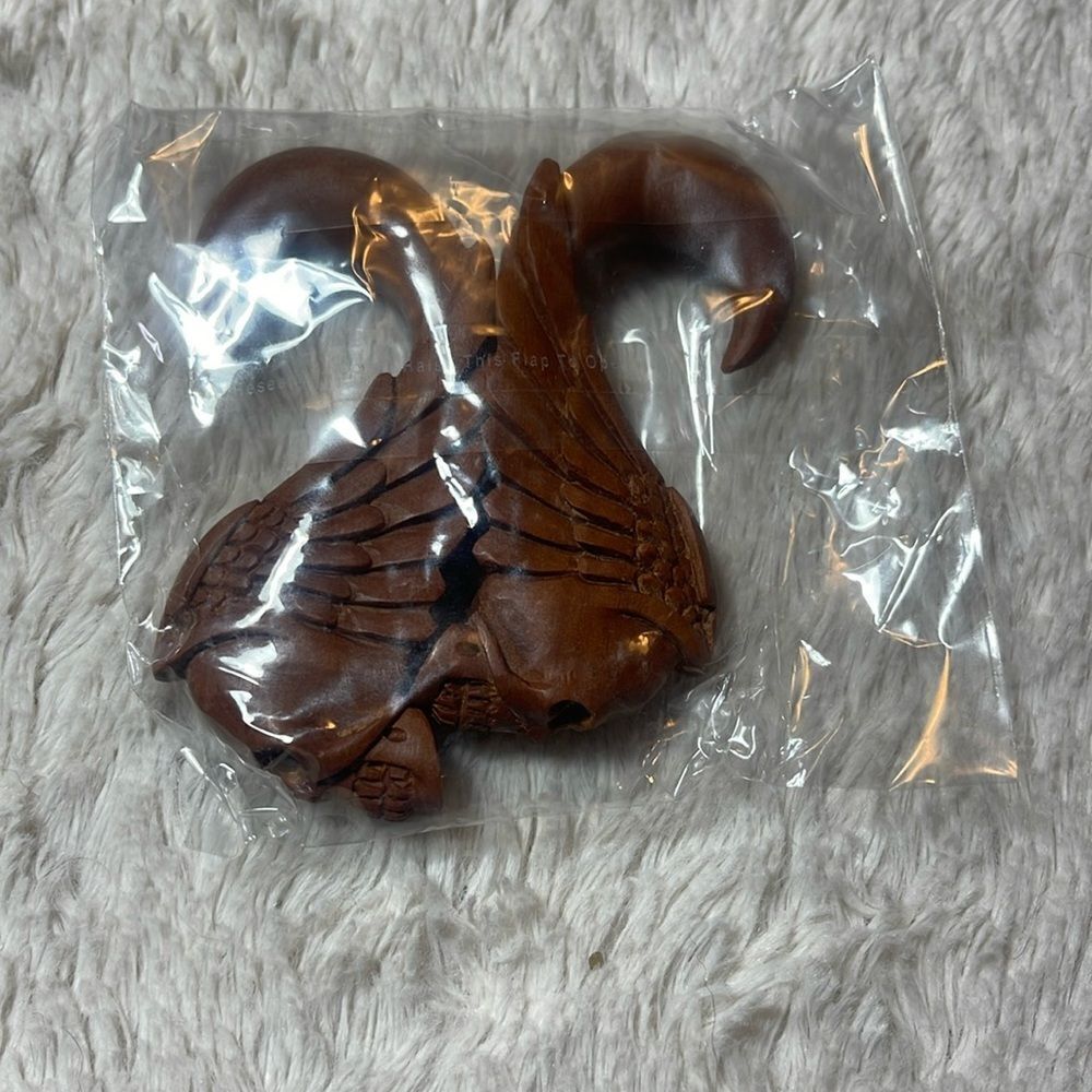 Hanging skull and wings wood carved gauges hanging